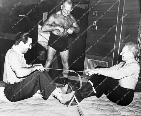 Walt DISNEY & LEOPOLD STOKOWSKI and hairy chested wrestler or exercise guru - 1940 film Fantasia - 0428-008