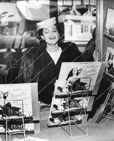 Dorothy Lamour at department store display window with her records for sale - 0441-028