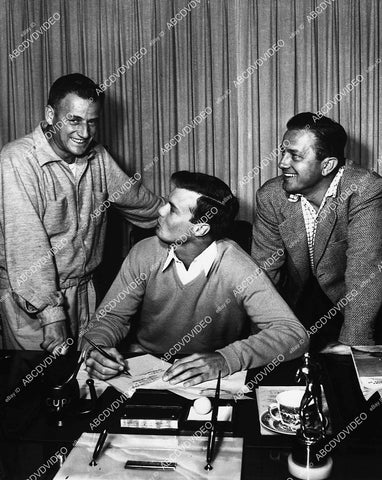 candid Stanley Kramer signing movie stars Robert Francis & Robert Bray film The Caine Mutiny - 11007-008
