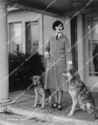 candid Lillian Rich w her two German Shepherd dogs - 11030-002