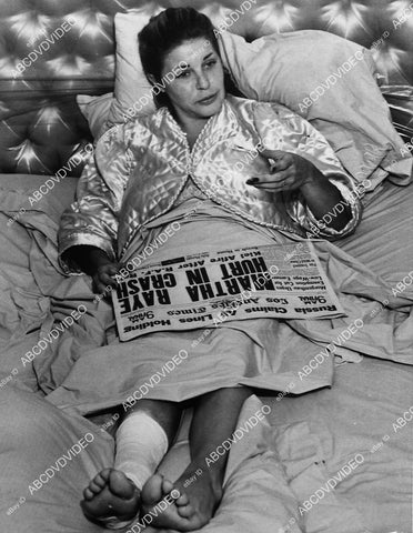Martha Raye reads newspaper of how she got hurt in car crash - 11031-003