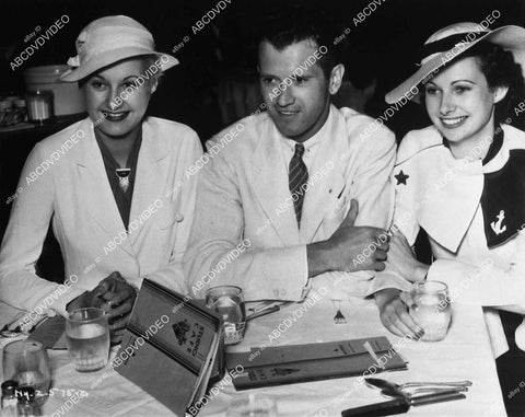 candid Lynne Carver w husband Ralph McClung & friend in RKO Studio's Café - 11031-007