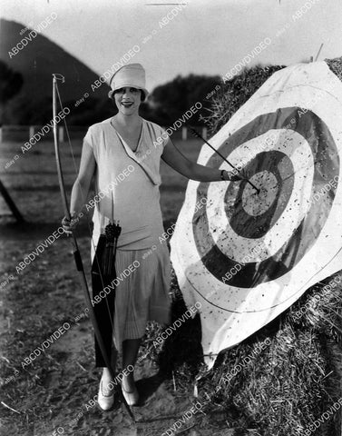 candid Irene Rich does archery target practice - 11031-035