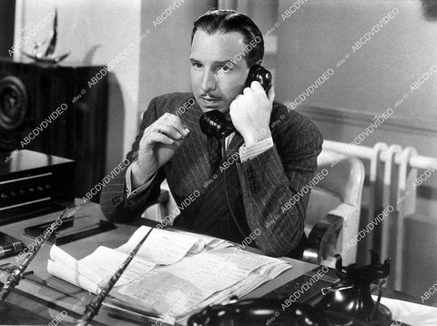 Lloyd Nolan at his desk on the telephone film Exclusive - 11036-021