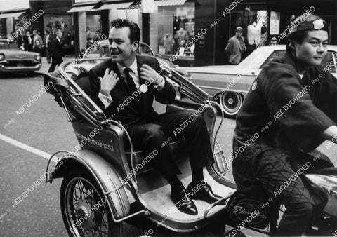 Bob Crane goes for a ride in a rickshaw 12592-18