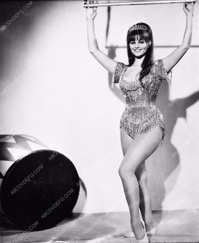 Claudia Cardinale hanging on trapeze swing film Circus World 410-01