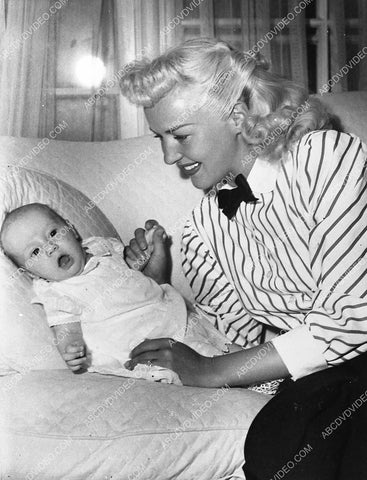 candid Betty Grable at home with the new baby 719-19