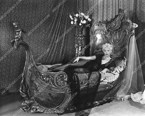 Burlesque stripper Lili St. Cyr laying in bed live show 798-04