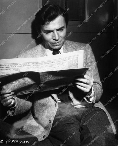 James Mason reading the newspaper behind the scenes 10307-17