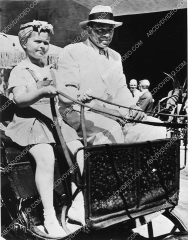 Shirley Temple driving a buggy for a parade or something maybe 1032-28