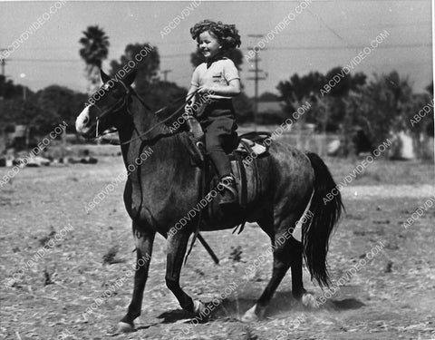 Shirley Temple enjoying a good horse ride 1032-29