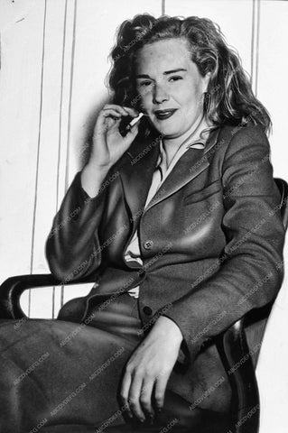 news Frances Farmer smoking a cigarette outside of courtroom 1104-17