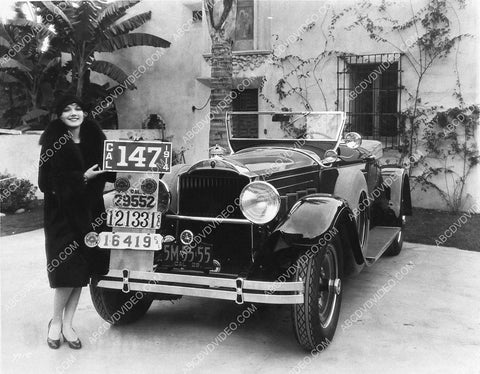 Leila Hyams w some old license plates and new 1929 Packard automobile 1141-34
