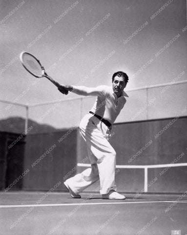 great candid of Warner Baxter showing his backhand on the tennis court 1324-13