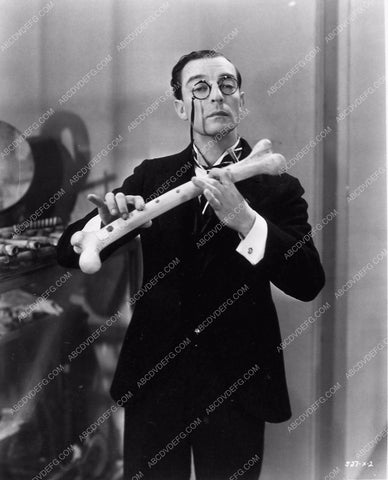 Buster Keaton with bone flute film Speak Easily 1376-12