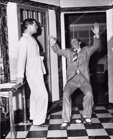 Clark Gable watches Keenan Wynn slip on bar of soap film The Hucksters 1483-06