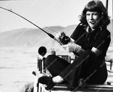 candid gertrude Niesen relaxes doing some fishing 1564-05