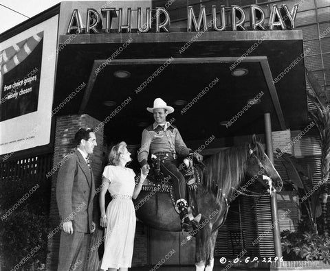 Gene Autry pays a visit to Arthur Murray at his dance studio 1578-11