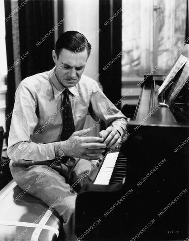 Colin Clive at the piano w his new hands film Mad Love 1593-13