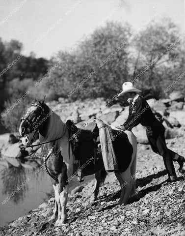 cowboy Bob Baker taking of the horses 1595-30