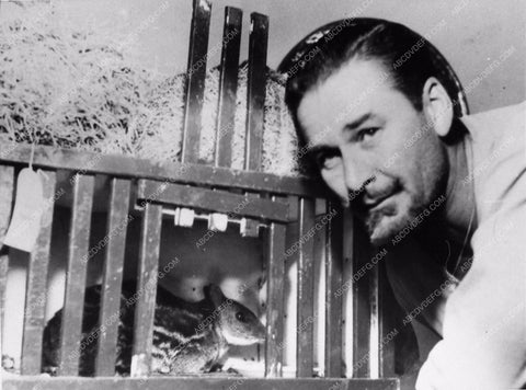 Errol Flynn behind scenes with a squirrel 1749-15