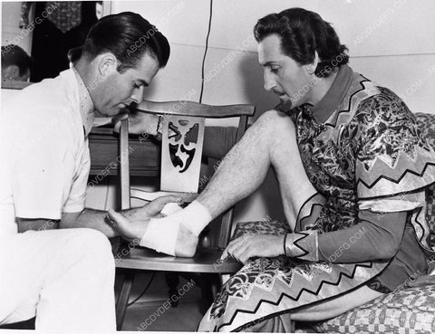 candid photo Basil Rathbone gets sprained ankle taken care of behind scenes 1752-15