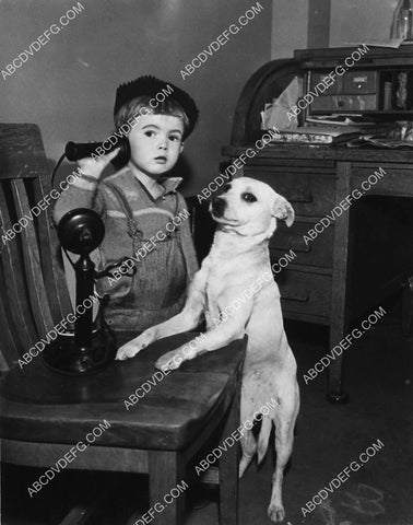 cute kid w his dog on old time candlestick telephone 1827-06