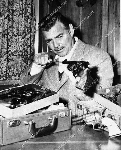 Clark Gable cleaning his gun collection 1909-06