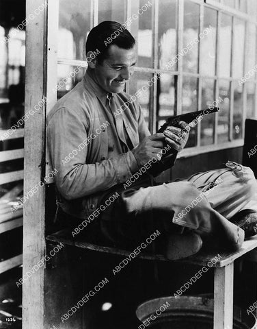 Clark Gable admiring his pistol 1909-29