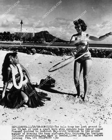 Hawaiian Hula dancer Puanani instructs Swedish stewardess Maj-Britt Eriksson how to hula hoop 1913-23