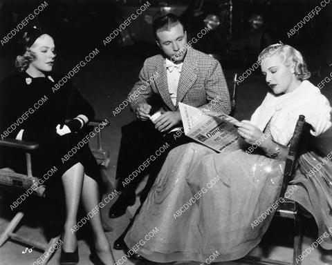 candid Alice Faye Dick Powell Madeleine Carroll on set 1921-07