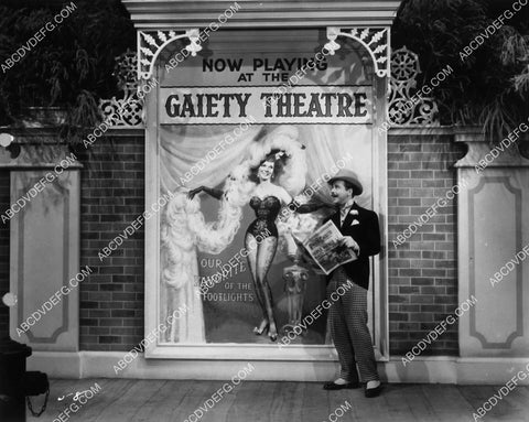 Dick Powell admiring the poster film On the Avenue 1921-20