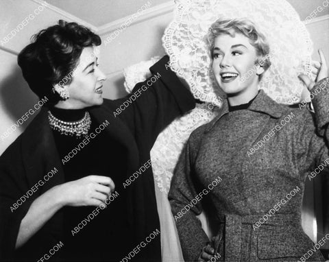 candid Doris Day trying on different wardrobe pieces 2159-34