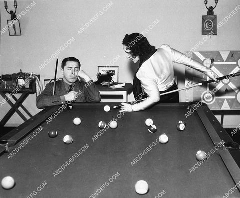 Joe Penner asleep while some cutie makes pool table trick shot 2169-03