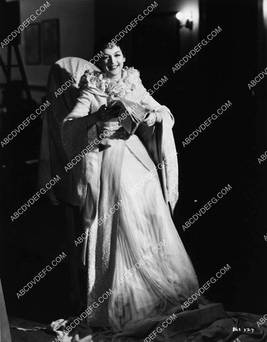 Rosalind Russell sitting in her costume wardrobe chair at MGM Studios 2197-16