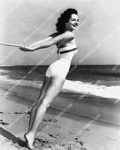 Viveca Lindfors in her new swimsuit w her toes in the sand 2250-34