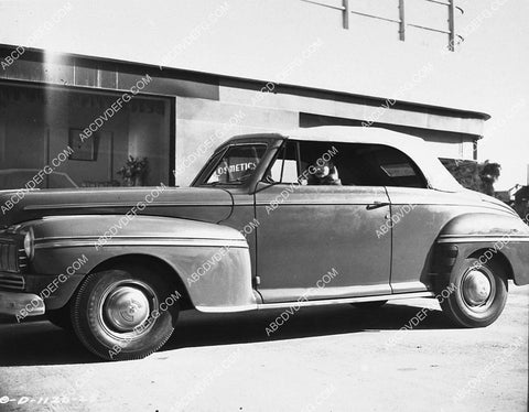Constance Dowling in her 1946 convertible Mercury automobile 2343-08