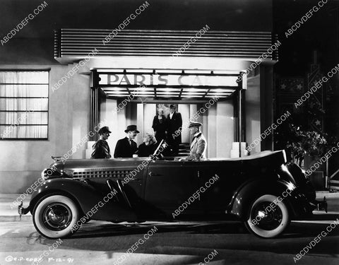 Mary Kornman takes her new 1935 Auburn convertible automobile to Paris Cafe 2343-14