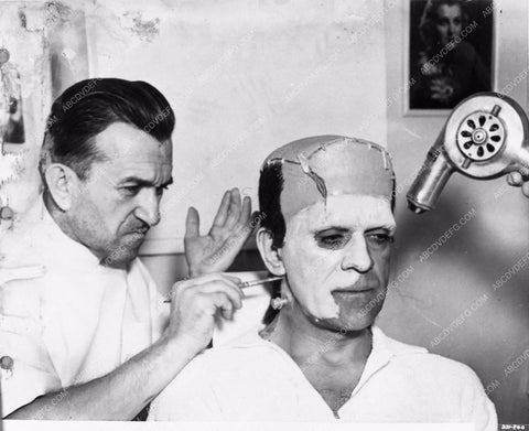 Jack Pierce applying Boris Karloff's Frankenstein makeup behind the sc 2706-27