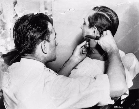 Boris Karloff sits patiently in Jack Pierce's makeup chair 2707-21