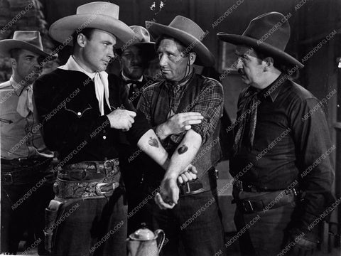 Dave O'Brien comparing tatoos western film Outlaw Roundup 2908-05