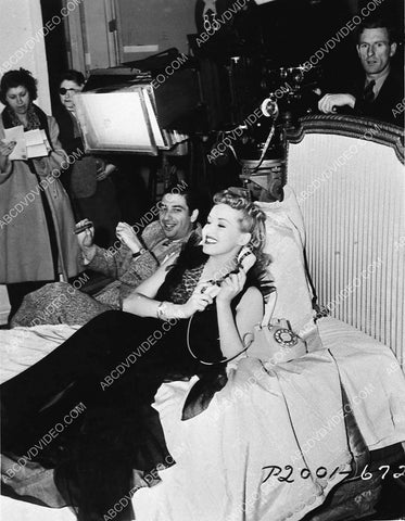 candid Betty Grable on set on the telephone 3031-35