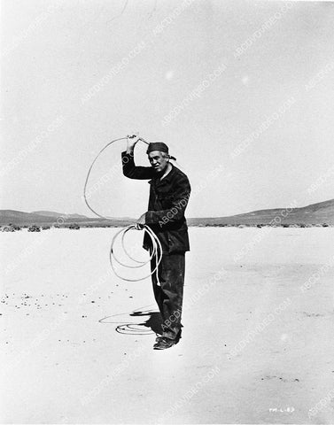 John Huston on location for The Misfits playing w his lasso 3051-22
