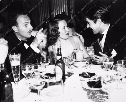 Tyrone Power and wife Annabella with Daryl Zanack dining 3451-03