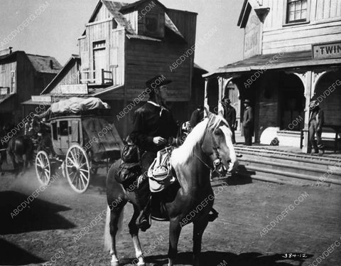 Randolph Scott rides into town film The Bounty Hunter 3497-21