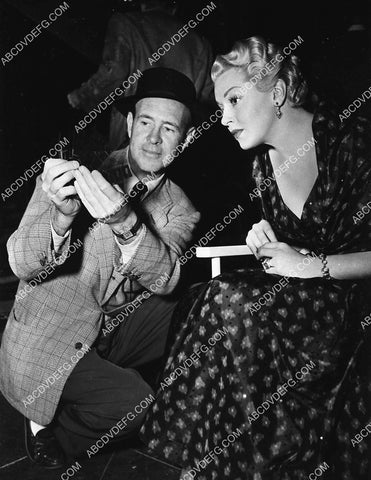 George Cukor and Lana Turner look at some negatives on set film A Life of Her Own 3517-25