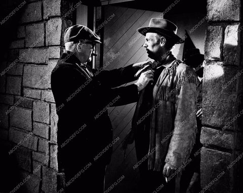 John Ford adjusting Richard Widmark's wardrobe film Two Rode Together 3568-36