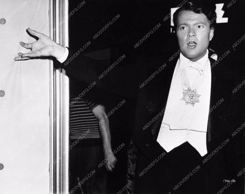 Orson Welles doing magic behind the scenes Follow the Boys 3573-26