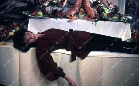 Jacqueline Bisset takes a nap on the buffet table 35m-841