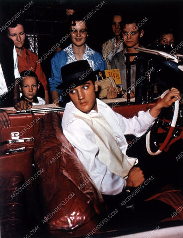 candid Elvis Presley in convertible surrounded by fans 35m-11297